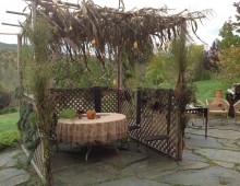 Gendlers continue to build home-grown sukkahs, replete with corn stalks and gourds.